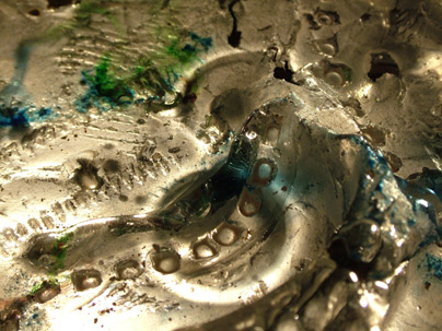 cast glass with metal inclusions