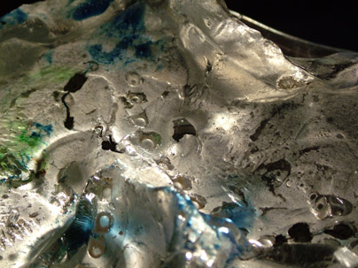Cast glass with metal includes